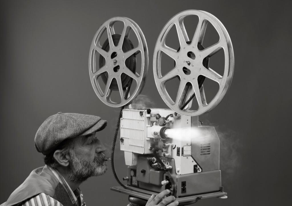 Old photo of a man and a vintage camera