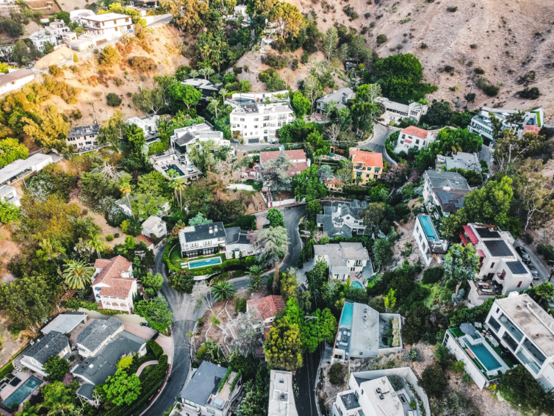 an aerial view of a residential neighborhood in the hills